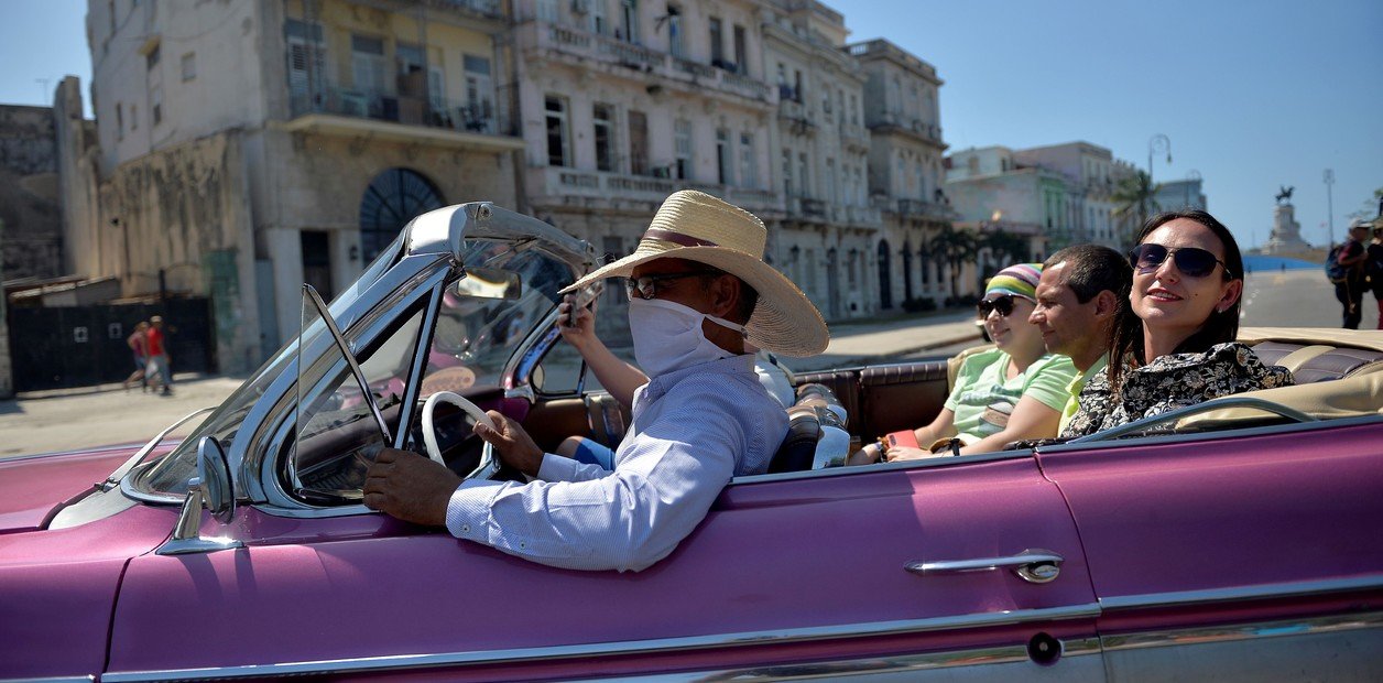 Rides in vintage cars for tourists in Havana, Cuba. 