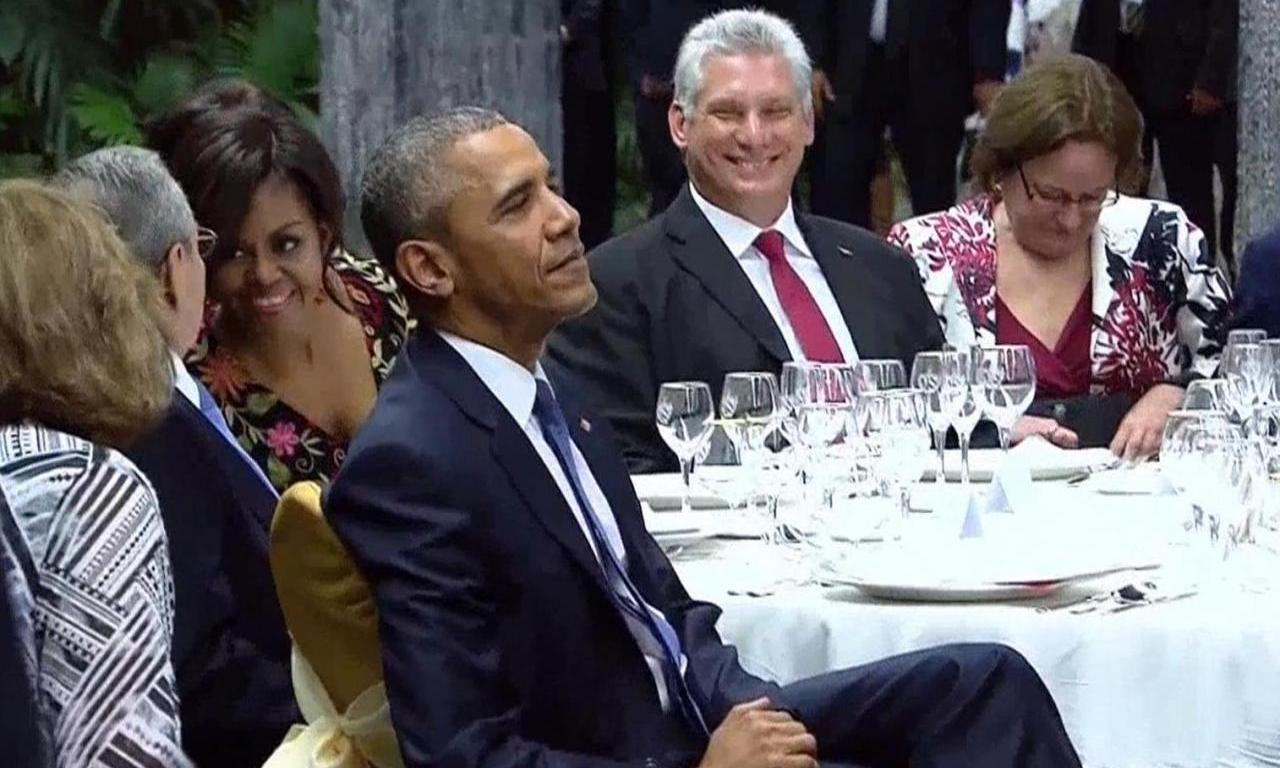 Miguel Díaz-Canel laughs while dining with Barack Obama in Cuba in 2016.