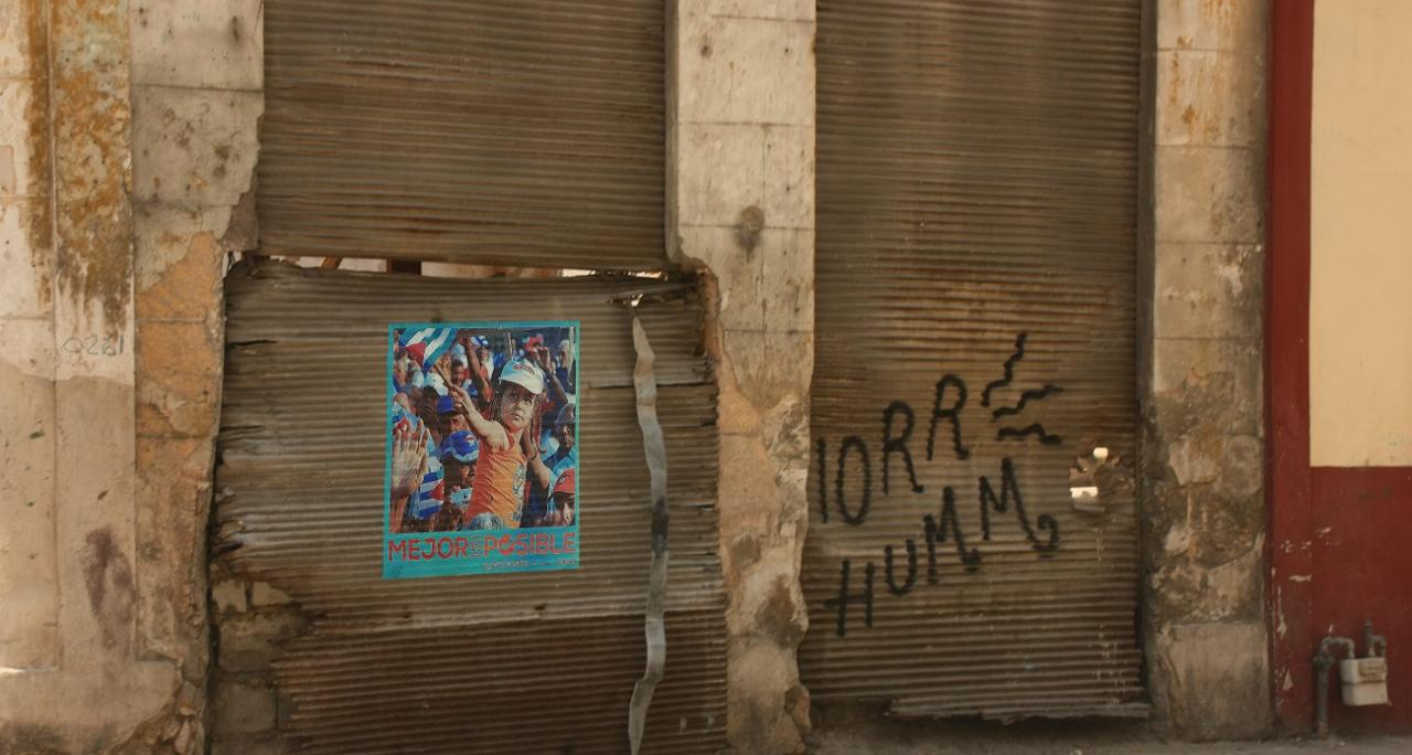Regime propaganda at a dilapidated store in Havana.